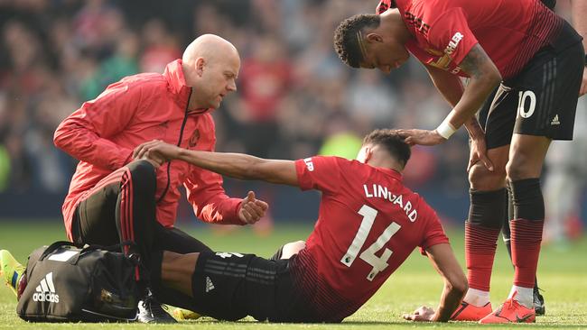 Manchester United's English midfielder Jesse Lingard gets attention on the pitch for an injury before being substituted. Picture: AFP