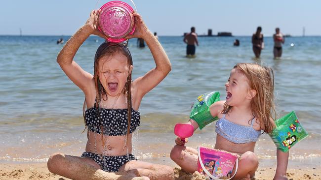 Mia and Isla enjoy family-friendly Half Moon Bay in Black Rock.