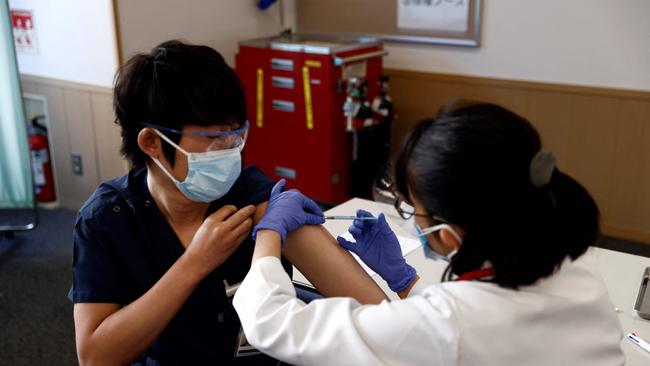 A medical worker receives a dose of the COVID-19 vaccine in Tokyo on Wednesday. Picture: AFP