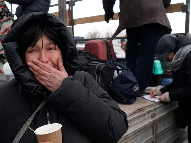 Evacuees from Mariupol are seen upon arrival at the car park of a shopping centre on the outskirts of the city of Zaporizhzhia, which is now a registration centre for displaced people. Picture: AFP