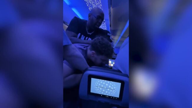 Drunk man held down by passengers on plane