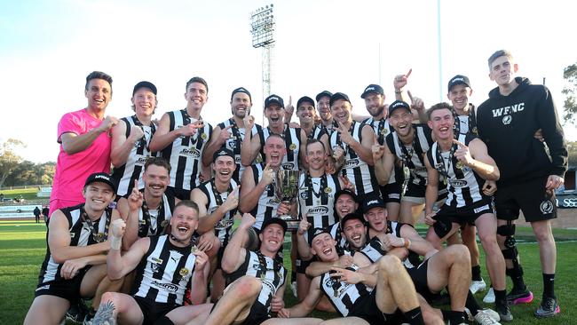 The Wangaratta Magpies pictured with the premiers cup after last year’s win. Picture: Yuri Kouzmin