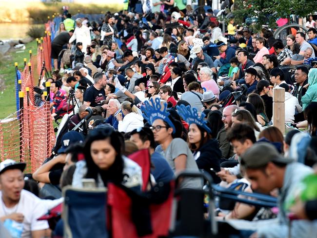 Families wait for the fireworks at Yarra Park. Picture: Jay Town
