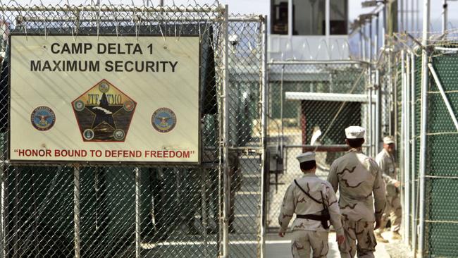 US military guards walk within Camp Delta military-run prison, at the Guantanamo Bay Naval Base in Cuba. Picture: AP