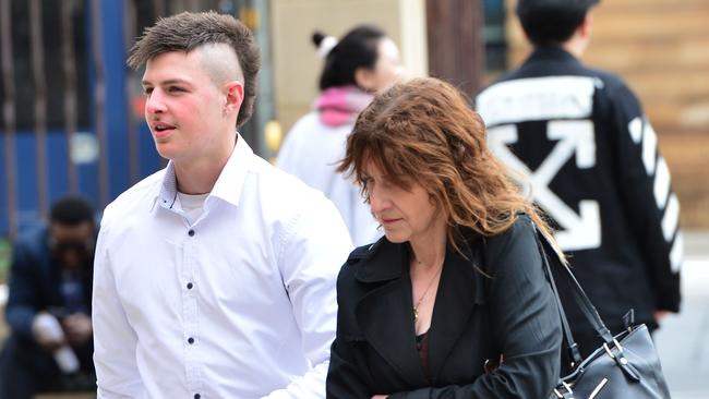 Brandon Agostino, left, and his mother arrive at Adelaide Magistrates Court. Picture: Keryn Stevens.