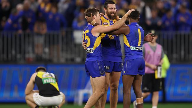 Eagles Jamie Cripps, Josh J. Kennedy and Liam Ryan celebrate the win over the Tigers. Picture: Paul Kane/Getty Images