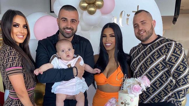 Jasmine Mackay, Grigori Kossian (holding baby), Vanessa Samra and Matthew Kevin Mackay at a christening party in May.