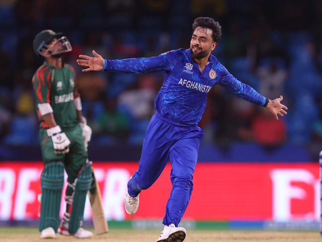 Rashid Khan, along with Naveen-ul-Haq, took four wickets each in the win that eliminated Australia. Picture: Darrian Traynor-ICC/ICC via Getty Images)