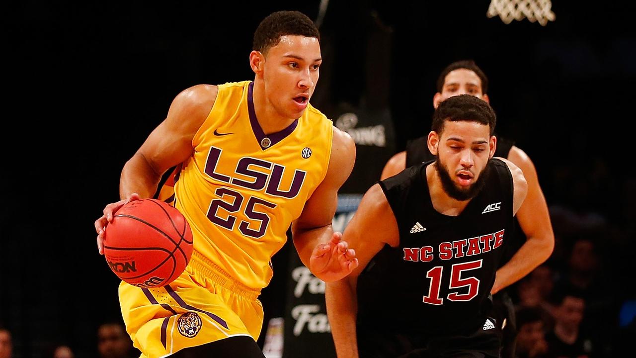 NEW YORK, NY - NOVEMBER 24: Ben Simmons #25 of the LSU Tigers carries the ball against Cody Martin #15 of the North Carolina State Wolfpack at Barclays Center on November 24, 2015 in Brooklyn borough of New York City. Mike Stobe/Getty Images/AFP == FOR NEWSPAPERS, INTERNET, TELCOS & TELEVISION USE ONLY ==