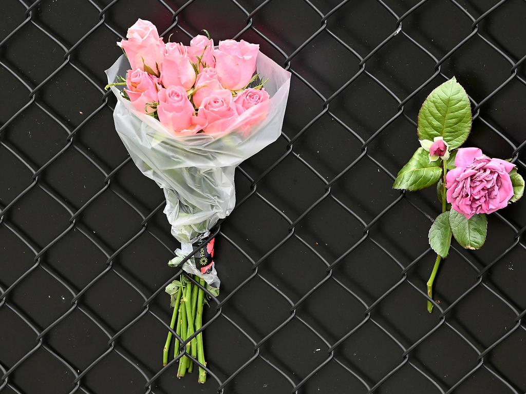 Flowers left at the scene at Murrumba Downs. Picture, John Gass