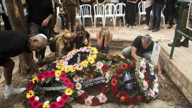 Family and friends of fallen Israel Defence Force soldier Afik Rozental, who died in a battle with Hamas militants, attend his funeral. Picture: Amir Levy/Getty Images