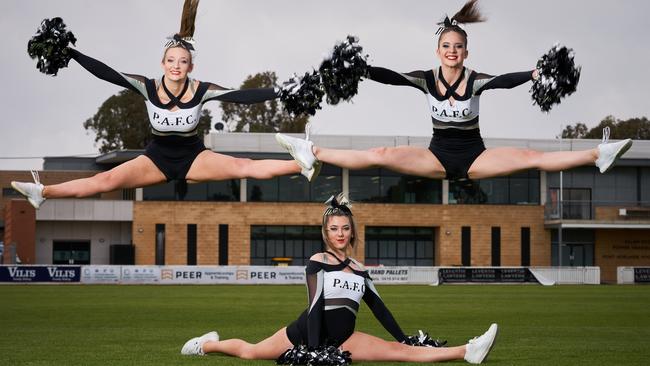 Port Adelaide cheerleaders Zenya Lodenstein, Abbey Harby and Gabriella Ward at Alberton Oval. The girls are pleased the SANFL is now allowing the group to perform before Sunday's grand final. Picture: Matt Loxton