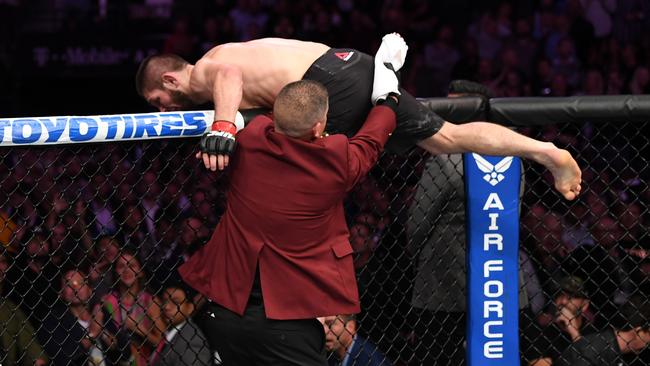 Khabib Nurmagomedov of Russia leaves the octagon in pursuit of members of the McGregor camp. Picture: Zuffa LLC/