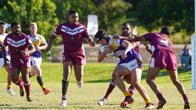 Edmonton's Lachlan Rayson is tackled by Yarrabah defenders. Picture: Nuno Avendano