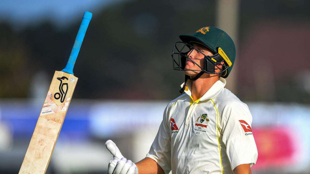 TOPSHOT - Australia's Marnus Labuschagne tosses his bat as he walks back to the pavilion after his dismissal during the first day of the first cricket Test match between Sri Lanka and Australia at the Galle International Cricket Stadium in Galle on June 29, 2022. (Photo by ISHARA S. KODIKARA / AFP)