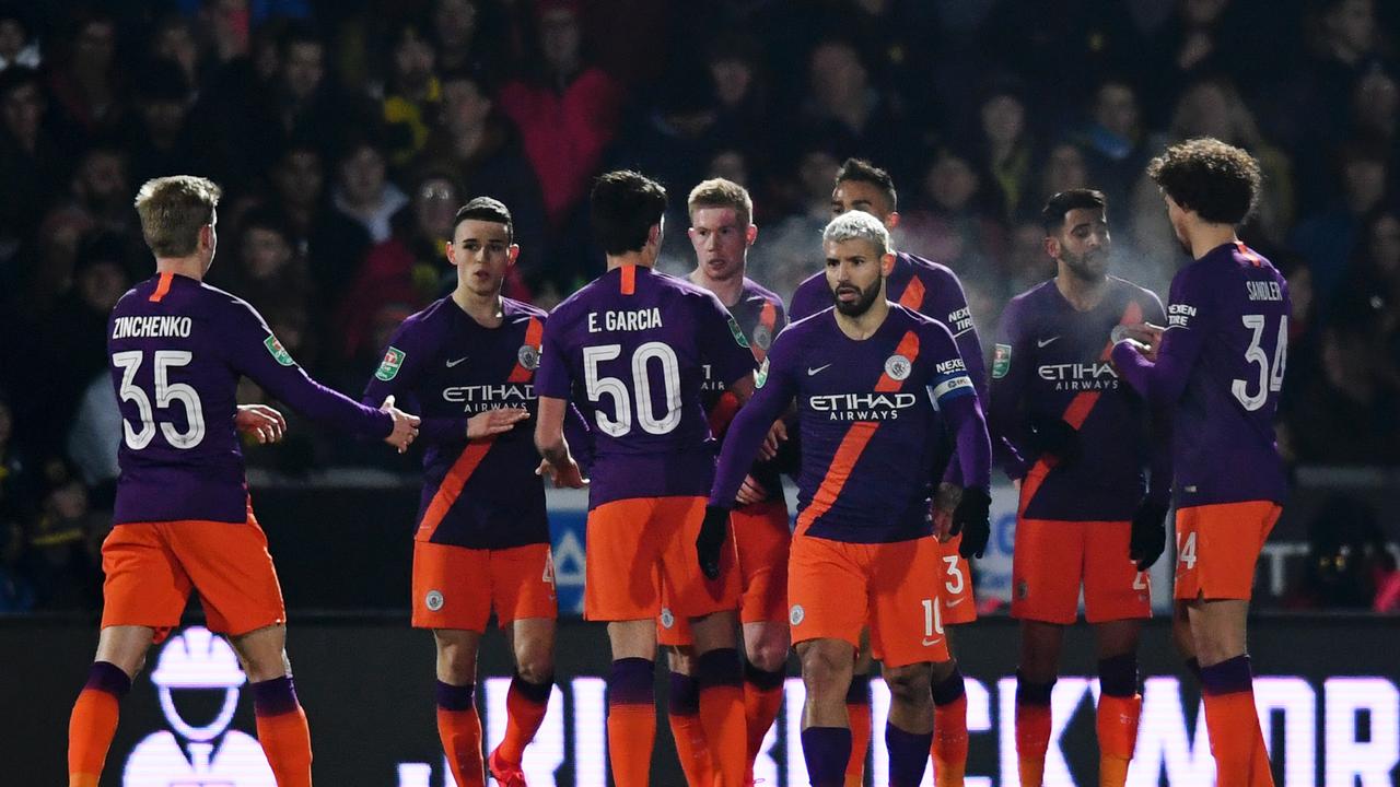 Sergio Aguero of Manchester City celebrates with team mates after scoring their side's first goal