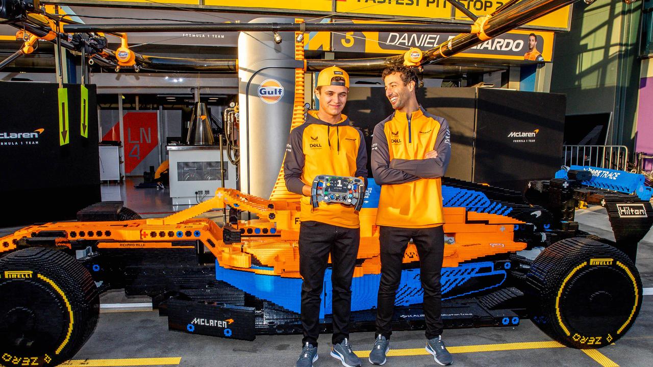 Daniel Ricciardo and Lando Norris inspect a full size McLaren F1 Lego car. Picture: Jake Nowakowski