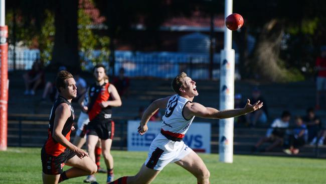 Michael Coad from Rostrevor juggles the ball under pressure from a Tea Tree Gully opponent. Picture: AAP Image/ Brenton Edwards