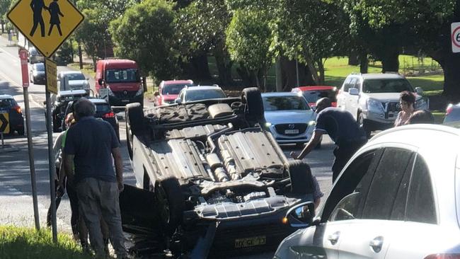 A car that flipped over at the intersection in December 2022.