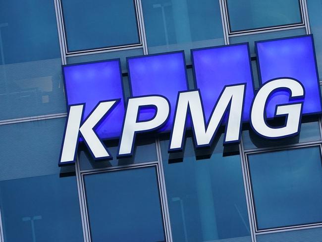 BERLIN, GERMANY - JANUARY 22: The logo of KPMG, a multinational tax advisory and accounting services company, hangs on the facade of a KPMG offices building on January 22, 2021 in Berlin, Germany. KPMG has come under the spotlight in Germany due to the company's role in the current Wirecard scandal.  (Photo by Sean Gallup/Getty Images)