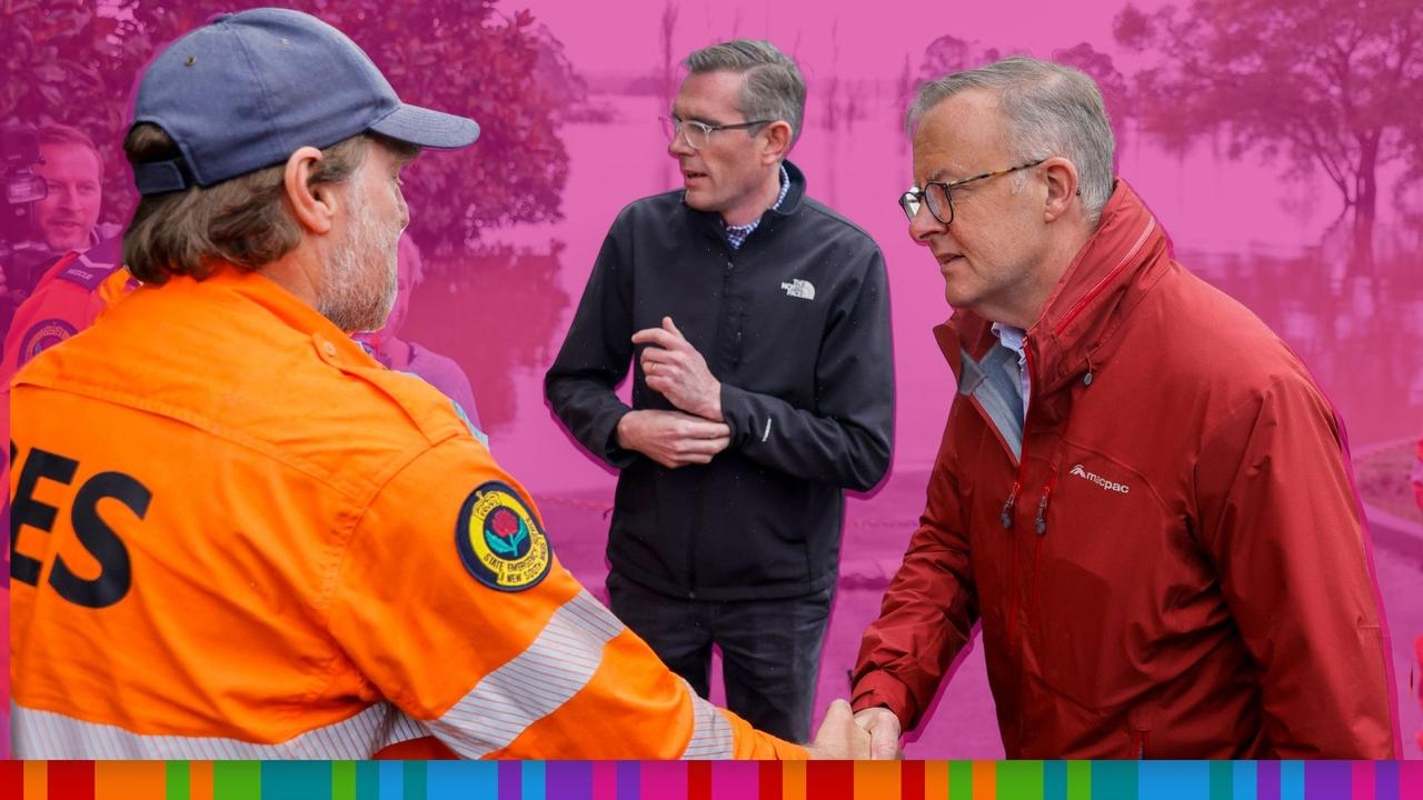 Prime Minister Anthony Albanese (R) shakes hands with State Emergency Service workers on a tour of flood-affected areas with New South Wales Premier Dominic Perrottet. Picture: Jenny Evans/Getty Images