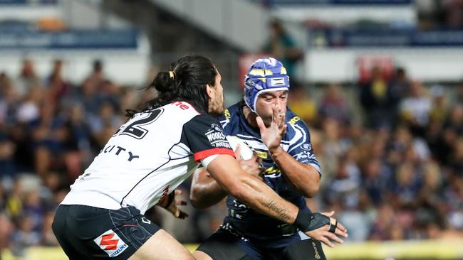 Johnathan Thurston, co-captain of the Cowboys is tackled by Tohu Harris of the Warriors during the Round 15 NRL match between the North Queensland Cowboys and the New Zealand Warriors at 1300SMILES Stadium in Townsville, Friday, June 15, 2018. (AAP Image/Michael Chambers) NO ARCHIVING, EDITORIAL USE ONLY