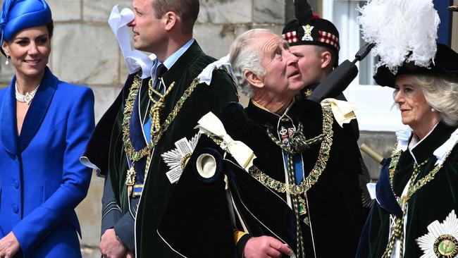 King Charles III stands with Queen Camilla, Prince William and Catherine, Princess of Wales to watch The Royal Air Force's aerobatic team, the Red Arrows, perform a fly-past over the Palace of Holyroodhouse in Edinburgh on July 5, 2023. (Photo by John Linton / POOL / AFP)