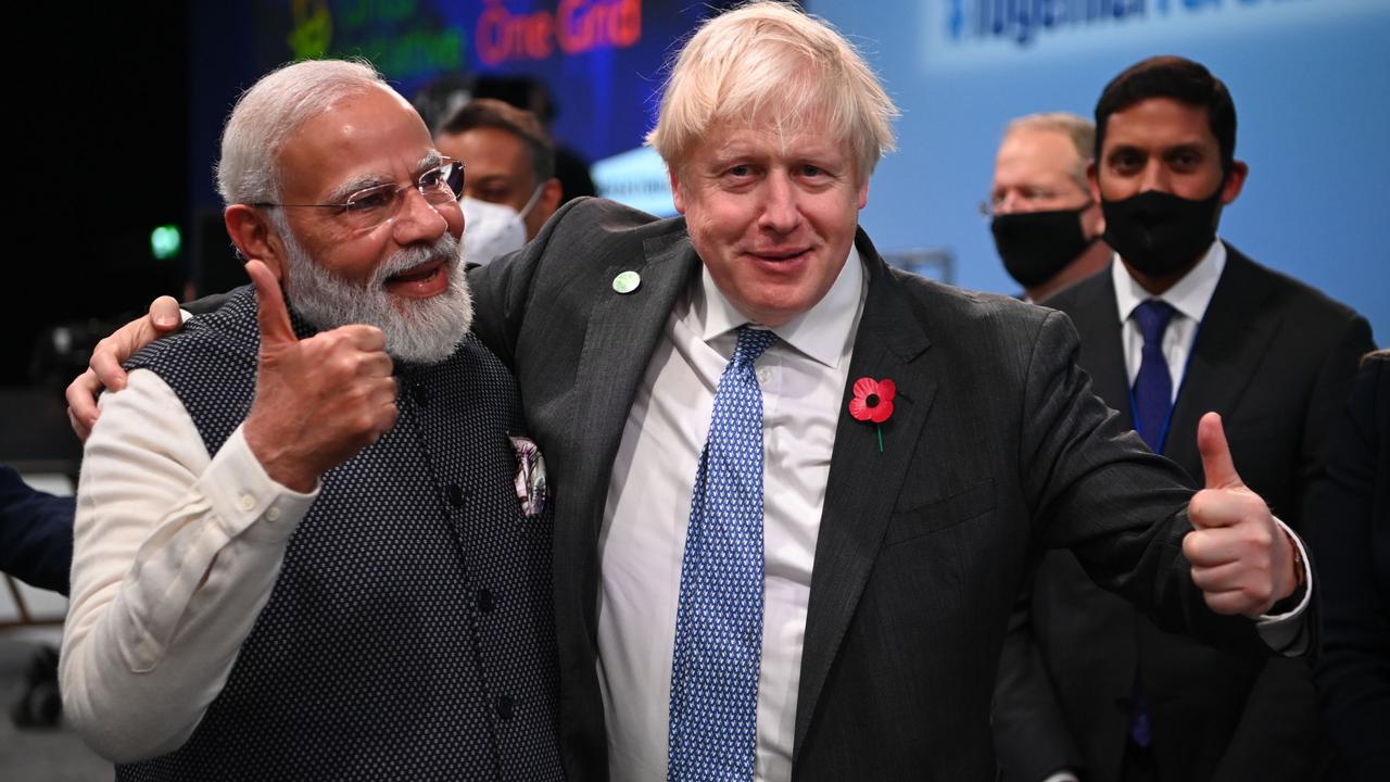 Britain's Prime Minister Boris Johnson and India’s Prime Minister Narendra Modi getting chummy in Glasgow. Picture: Jeff J Mitchell/Getty Images