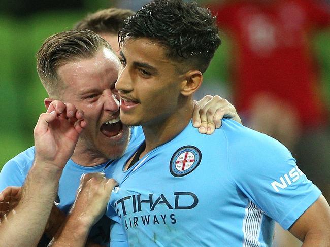 Daniel Arzani (right) of Melbourne City is congratulated by teammate Scott Jamieson after scoring their first goal during the A-League Round 18 match between Melbourne City FC and Newcastle Jets at AAMI Park, Melbourne, on Thursday, January 25, 2018. (AAP Image/Hamish Blair) NO ARCHIVING, EDITORIAL USE ONLY