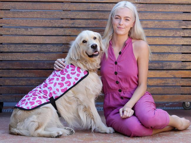 Nicole Westmoorland with Golden Retriever Owen wearing a Westmoorland jacket. Picture: Norm Oorloff