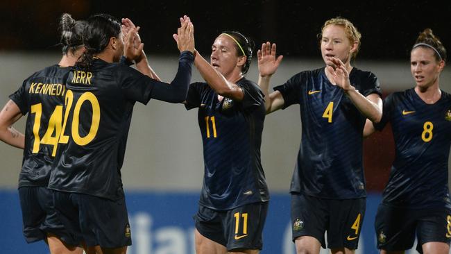 Players of Australia celebrate. (Photo by Octavio Passos/Getty Images)