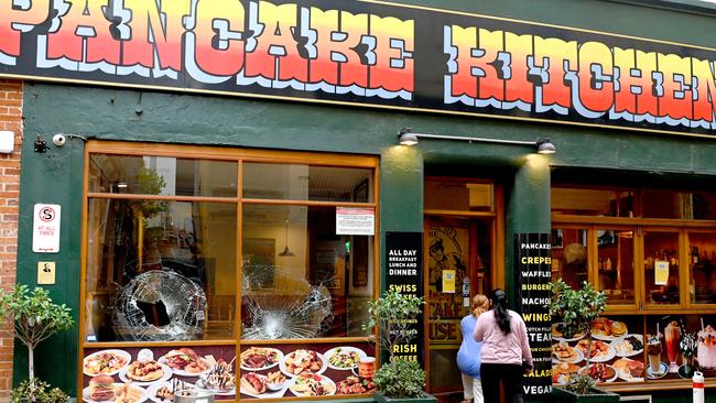 Damage to a window at the Original Pancake Kitchen on Gilbert Place. Picture: Naomi Jellicoe