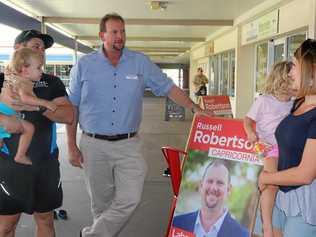 OUT WEST: ALP candidate for Capricornia Russell Roberston talks politics with Brodie Long and Milly Duggan in Moranbah.