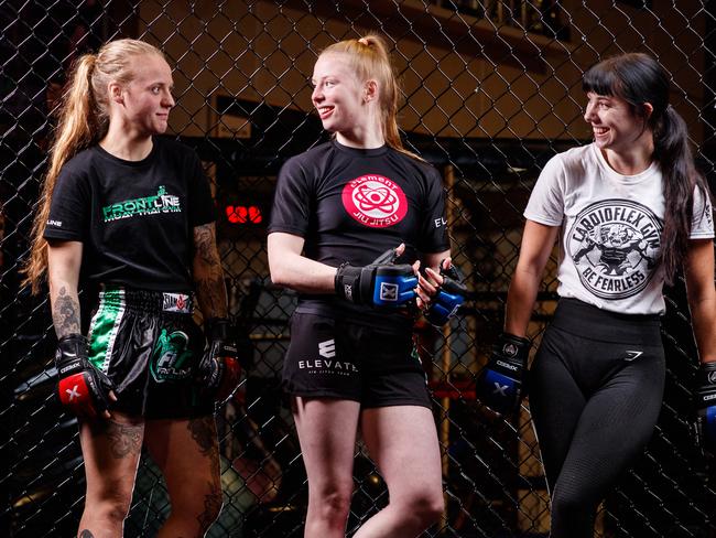 Michaela Curran, Tahlia Graetz and Nina Cuckovic, MMA fighters at Cardioflex MMA Gym, Pooraka. picture by Matt Turner.