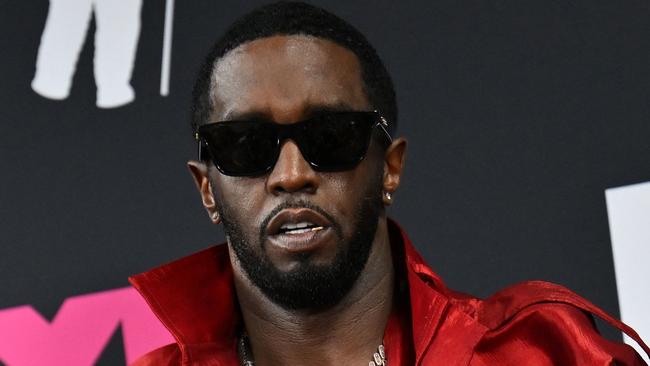 (FILES) US producer-musician Sean "Diddy" Combs poses with the Global Icon award in the press room during the MTV Video Music Awards at the Prudential Center in Newark, New Jersey, on September 12, 2023. The music industry has long evaded a #MeToo reckoning like that experienced in Hollywood or the media, but the blockbuster charges against hip hop magnate Sean Combs could finally prove an inflection point. (Photo by ANGELA WEISS / AFP)