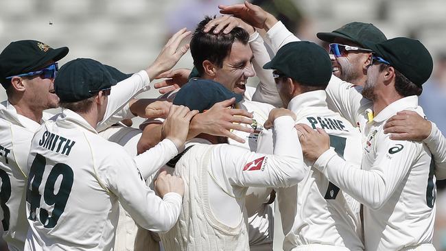 Pat Cummins celebrates with teammates during the first Test. Picture: Getty Images