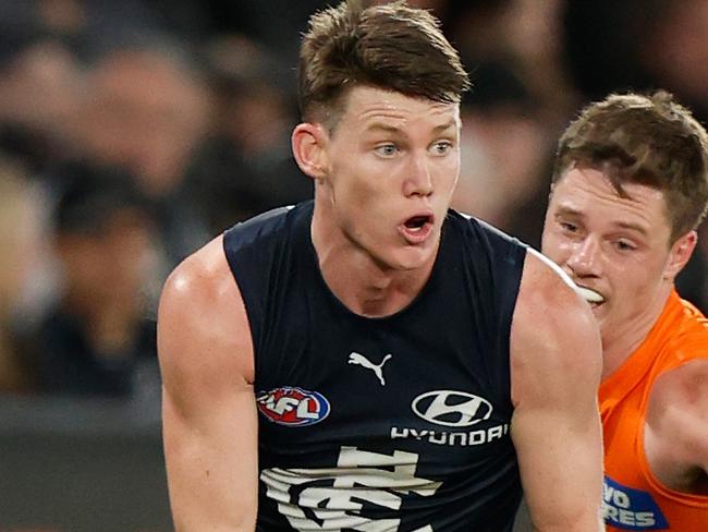 MELBOURNE, AUSTRALIA - JULY 24: Sam Walsh of the Blues is chased by Jacob Wehr of the Giants during the 2022 AFL Round 19 match between the Carlton Blues and the GWS Giants at Marvel Stadium on July 24, 2022 in Melbourne, Australia. (Photo by Michael Willson/AFL Photos via Getty Images)