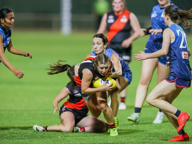 Caitlin Couch of Wests is tackled in the women's CAFL grand final. Picture: AFLNT.