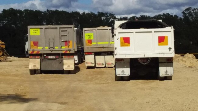 Trucks arriving at Black Swan Lake on the Gold Coast when the fill first started.