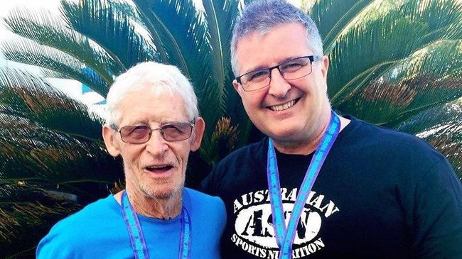 STRONG: Derek Mason, 80, is a world record holder, with coach John Ross. Picture: Contributed