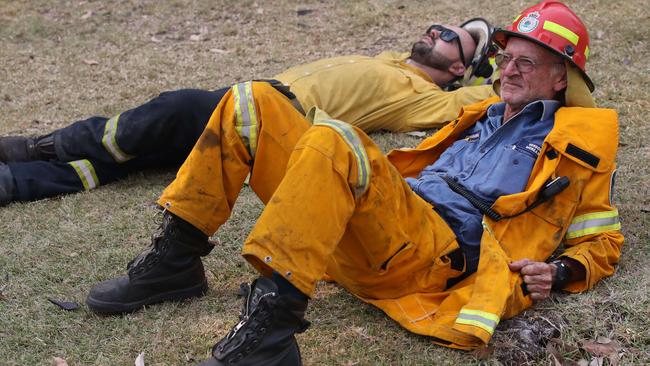 Firefighters Andrew Wise and Captain Gordon Morgan take a well-earned break. Picture: David Swift.