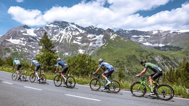 Cyclists Italy's Samuele Zoccarato, Austria's Michael Gogl, Norway's Andre Drege, the Netherland's Oscar Riesebeek and Germany's Jonas Rapp ride in a partly snow-covered mountain area during the 4th stage of the 2024 Tour of Austria on July 6, 2024. Photo by Johann GRODER AFP.