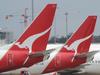 **FILE** A file photo of Qantas planes at Sydney Airport, Sydney, Saturday, Nov. 6, 2010. Qantas announced on Tuesday, Aug. 16, 2011, it will make dramatic changes to its international business to make it profitable in a process that will affect 1,000 jobs. (AAP Image/Dean Lewins, File) NO ARCHIVING