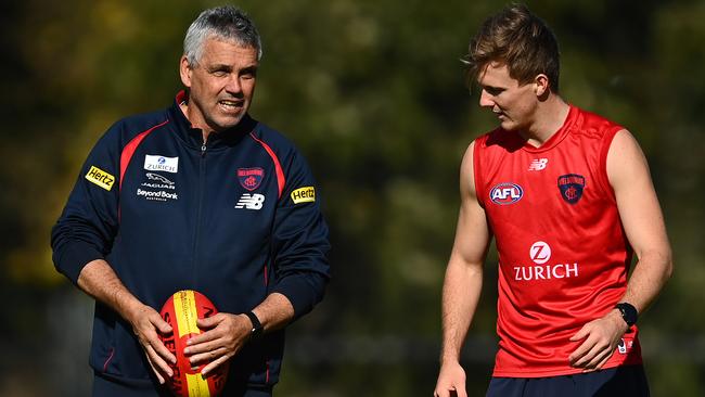 Demons assistant coach Mark Williams with midfielder James Jordan at training. Picture: Quinn Rooney/Getty Images