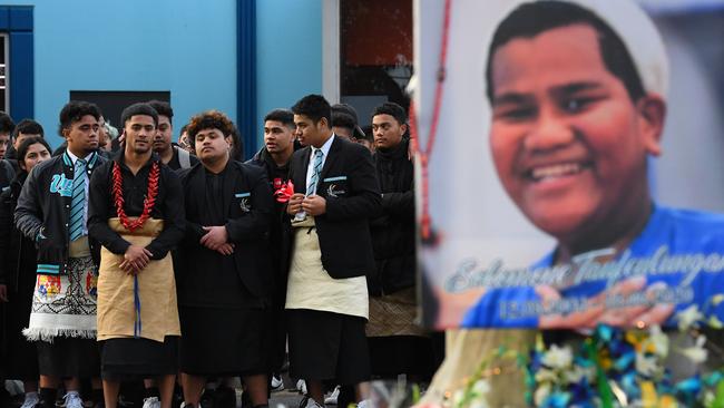 Students from Victoria University Secondary College look on during a memorial for Solomone Taufeulngaki outside Brimbank Shopping Centre. Picture: AAP