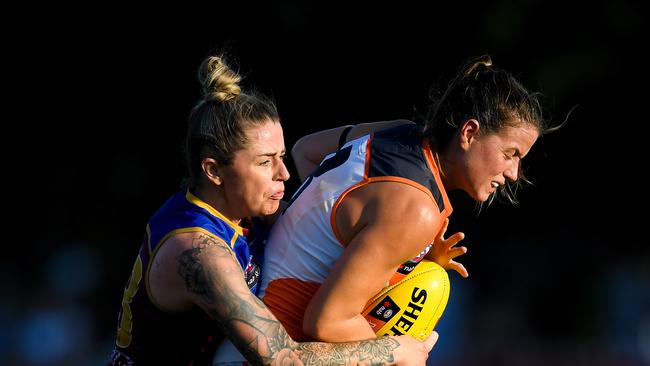 Nicola Barr of the Giants is tackled by Jess Wuetschner of the Lions during the round 4 AFLW match between the Brisbane Lions and the GWS Giants at Hickey Park in Brisbane, Sunday, March 1, 2020.