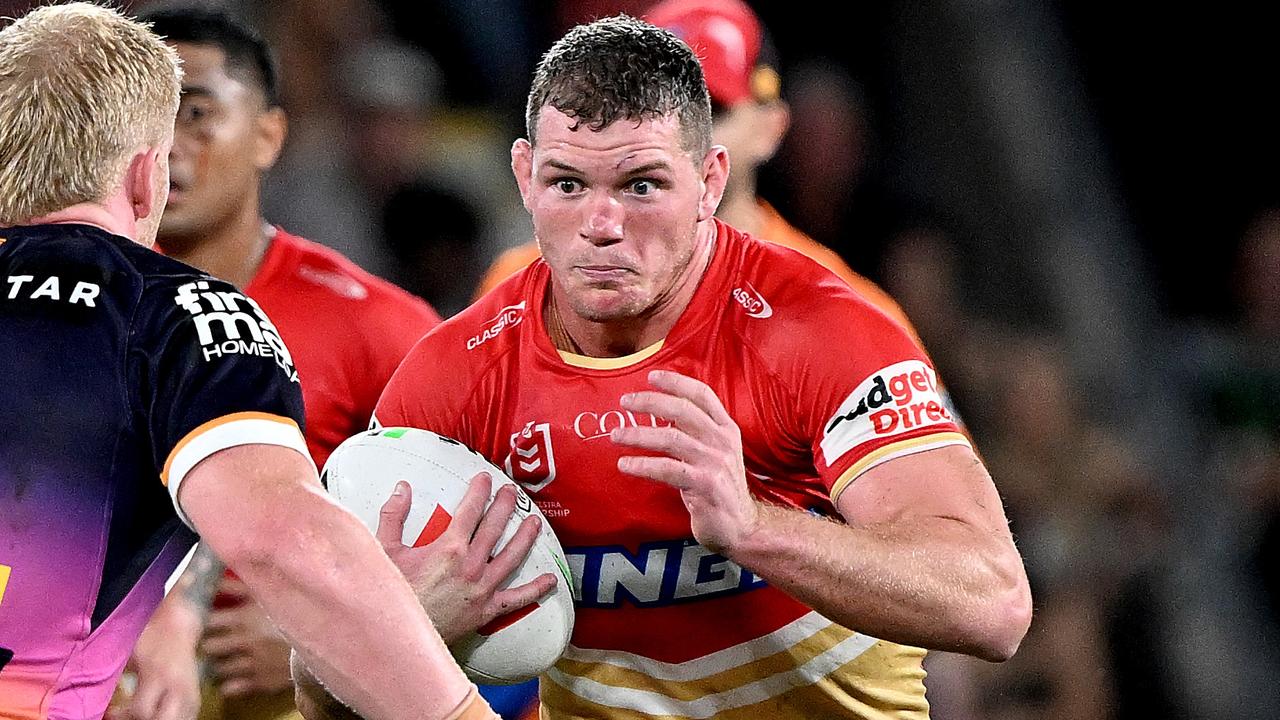 BRISBANE, AUSTRALIA - MARCH 24: Tom Gilbert of the Dolphins takes on the defence during the round four NRL match between the Dolphins and Brisbane Broncos at Suncorp Stadium on March 24, 2023 in Brisbane, Australia. (Photo by Bradley Kanaris/Getty Images)