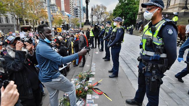 Protesters lay tributes on the steps of Parliament House. Picture: Jason Edwards