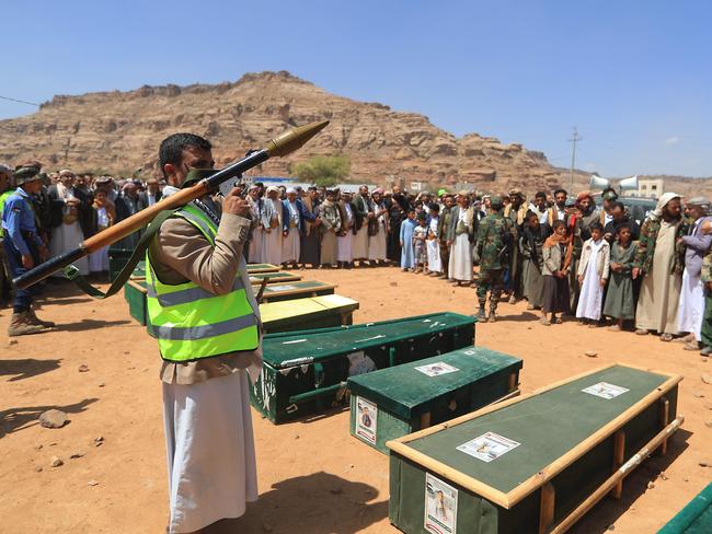 A man holds a rocket-propelled grenade launcher as Yemenis attend the funeral of people killed in reported US strikes last week. Picture: AFP