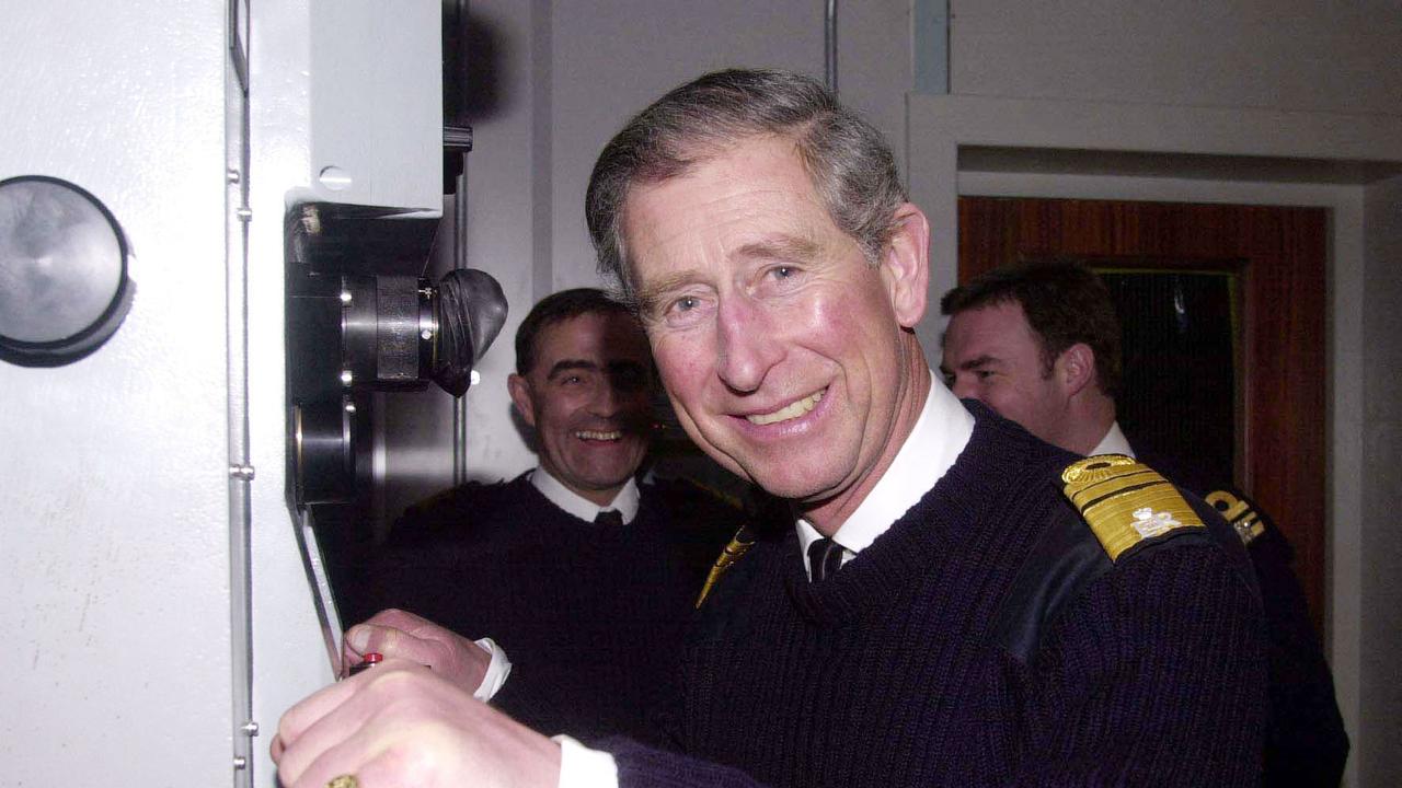 Prince Charles looks through a periscope during his visit to the submarine command trainer based at the HM Naval Base in Devonport in 2004. Picture: AFP